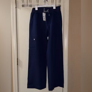 Figs Navy Blue Women's Isabel high waisted wide leg scrub pants.
